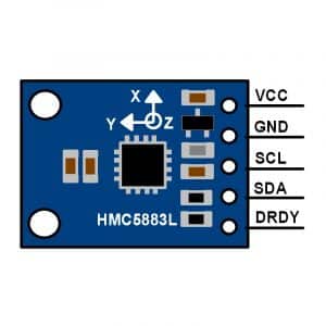 Vue rapprochée d'un module HMC5883L montrant les connexions étiquetées "VCC", "GND", "SDA", et "SCL". Le module est de couleur bleue et comporte plusieurs composants électroniques.